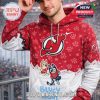 A red and white hoodie with New Jersey Devils logo and Bluey characters wearing hockey uniforms surrounded by paw print patterns!