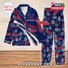 Blue and red New York Giants pajama set with floral details and custom name print, arranged on a wooden surface!