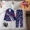 New York Giants-themed pajama set with tropical floral overlays and custom text, laid out on a neatly made bed!