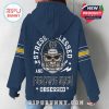 Woman modeling navy Notre Dame hoodie from the back with fan slogan and skull helmet graphic!