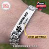 Wrist-worn view of silver Fighting Irish bracelet, showing engraved logo and custom name text on metal plate in natural lighting!