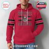 Ohio State Buckeyes hoodie in red, modeled casually by a man. Shows bold skull logo on the chest and striped arms!