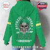 Detailed back of green Oregon hoodie with graphic football helmet skull, surrounded by stars and lightning for bold fan expression!