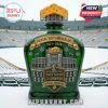 A close-up view of the Green Bay Packers 105th Anniversary whiskey decanter, highlighting the intricate stadium design and crown.