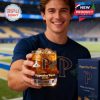 A male model poses with a Pepperdine-themed whiskey glass in hand, emphasizing its design and spirit of tradition on the field!