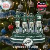 Christmas ornament showing four Philadelphia Eagles players from behind with jersey numbers 98, 6, 65, and 26. They stand on a round green base with the Eagles logo and nostalgic text, hanging on a Christmas tree with lights and ornaments!