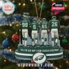 Ornament of four Philadelphia Eagles players with snowfall overlay, enhancing the festive and wintry mood. Positioned on a Christmas tree with bright decorations and a visible Eagles logo beneath the players!