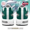 Rear view of sports-themed Christmas sneakers with holiday mascot design and green heel panel!