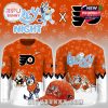 Front and back view of orange hockey shirt and matching cap with cartoon character graphics!