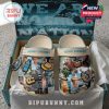 Colorful Kenny Chesney Crocs with tropical designs and beach-themed accessories such as hats and guitars.
