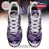 Top view of purple paisley-patterned sneakers with bold crown logo and themed graphics!