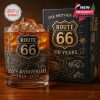 Route 66 whiskey glass with 100th anniversary artwork and vintage-inspired gift box, placed on a wooden surface under warm lighting!
