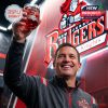 Rutgers Scarlet Knights whiskey glass with 1869-2026 text, held by a smiling man.!