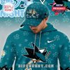 A man wearing a teal San Jose Sharks hoodie and cap set with Bluey cartoon graphics and hockey inspired design!