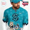 Detailed side shot of teal Bluey-themed Seattle Kraken jersey worn by a male model, with cartoon characters and logo in clear view!