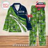 Seattle Seahawks pajama set displayed flat with green floral patterns and official logos, featuring bold team branding and custom name option!