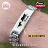 SMU Mustangs engraved stainless steel bracelet with customizable name shown on wooden background.