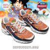 Side profile of anime-styled sneakers on a white platform, highlighting vibrant design and cartoon artwork!