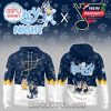 A matching hoodie and baseball cap set with navy colors and cartoon dogs playing hockey in a fun themed design.