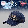 A navy baseball cap featuring cartoon hockey characters and a playful themed pattern.