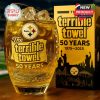Collectible whiskey glass honoring The Terrible Towel's 50th anniversary with football stitches, team logo, and Heinz Field sketch, paired with a vibrant gift box!