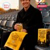 Man seated at stadium with golden towel and glass commemorating The Terrible Towel’s 50-year milestone, paired with celebratory box!