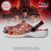 A single red clog with detailed Stranger Things designs shown from the side, placed in front of a themed background poster!