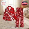 Custom name red pajamas with Tampa Bay Buccaneers branding and floral designs, staged in a bright bedroom with curtain and cozy decor!