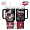 White-based insulated tumbler with black handles and Buccaneers-themed graphics including the stadium, flaming football, team logo, and energizing text at the bottom. Cheerful crowd silhouette decorates the top band!