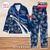 Front view of Tennessee Titans football pajama set with navy and blue theme, hibiscus flower pattern, custom name space, and team logos on top and pants!