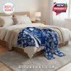 Tennessee Titans pajamas displayed on beige blanket and wooden bed with white bedding, showcasing full coordinated design and team-themed details!