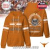 Orange hoodie with Texas Longhorns logo and text on the front. Back shows a skull in a helmet with fan slogan. Designed for college football enthusiasts.