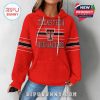 Red hoodie worn by female model showing Texas Tech pride through team graphics and stylish sleeve accents.