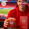 Toronto FC fan holding limited edition whiskey glass at the stadium with branded box and club colors in view.