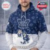 A person wearing a navy and white Toronto Maple Leafs hoodie with Bluey characters and winter inspired details!