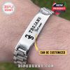 Personalized USC Trojans engraved silver bracelet worn on wrist with logo and name detail.