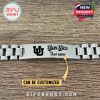 Utah Utes silver bracelet with engraved logo and personalized name option on wooden table.
