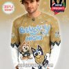 Male model wearing a Vegas Golden Knights Bluey Night hockey jersey in gold with cartoon characters and official team logo!