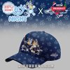 A themed cap with Bluey and Bingo characters playing hockey on the front panel, surrounded by a navy base filled with paw prints and Washington Capitals branding!