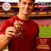 A man displays a Washington Commanders whiskey glass featuring a bold 