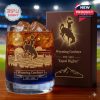 Wyoming Cowboys whiskey glass with engraved cowboy artwork and landscape design placed next to a branded collector box!