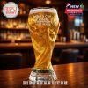 Beer glass shaped like the World Cup trophy on a bar counter with inscription World Cup 2026 Champions Are Made.
