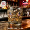 Patriotic collector’s glass with detailed artwork and engravings highlighting American independence, displayed on a bar surface under warm lighting.