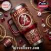 The Alabama Crimson Tide 40oz tumbler stands out with its detailed red and gold finish, diamond-style inlays, and central 