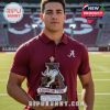 Player holding Crimson Tide whiskey bottle on football field!