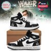 Custom black and white Alan Walker sneakers with signature and AW logo, with a Walker World tour backdrop.