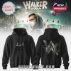 Black hoodie with signature and logo, featuring an abstract design, set against the Walker World tour backdrop.