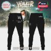 Alan Walker in **Walkerworld Tour sweatpants** with **AW branding** and his signature, completing a stylish outfit with the hoodie.