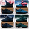 Low top NFL sneakers in red black teal blue and green with team logos and fan messages.