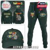Green Packers outfit set with Toy Story 5 details, including a hoodie, pants, and cap filled with stars and animated characters.